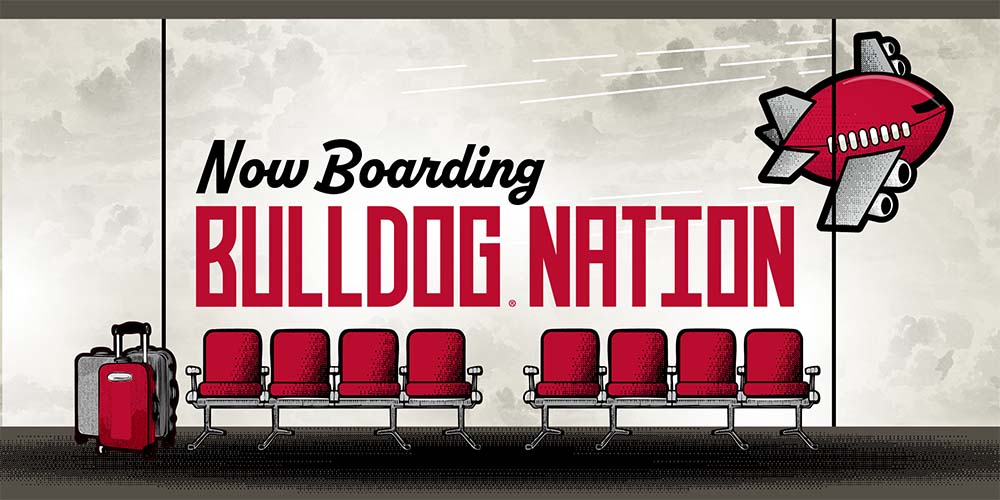 Airplane seats and luggage; 'Now Boarding Bulldog Nation'